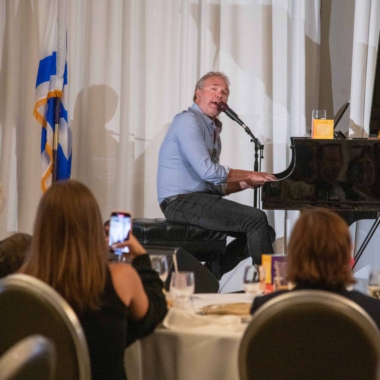 John Ondrasik playing piano.