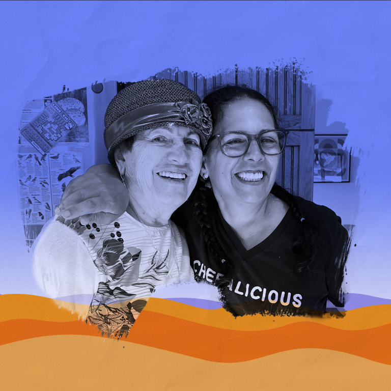 Photo of Einat Admony smiling, wearing a black t-shirt with the word CHEFALICIOUS on it, arm around with her mother Ziona, who is wearing a hat, paintbrush effect around the photo, laid over a graphic representation of the desert