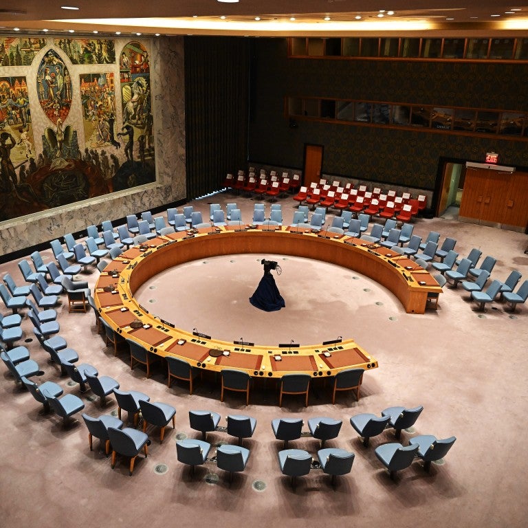 UN Securty Council Chamber with empty chairs and circular table